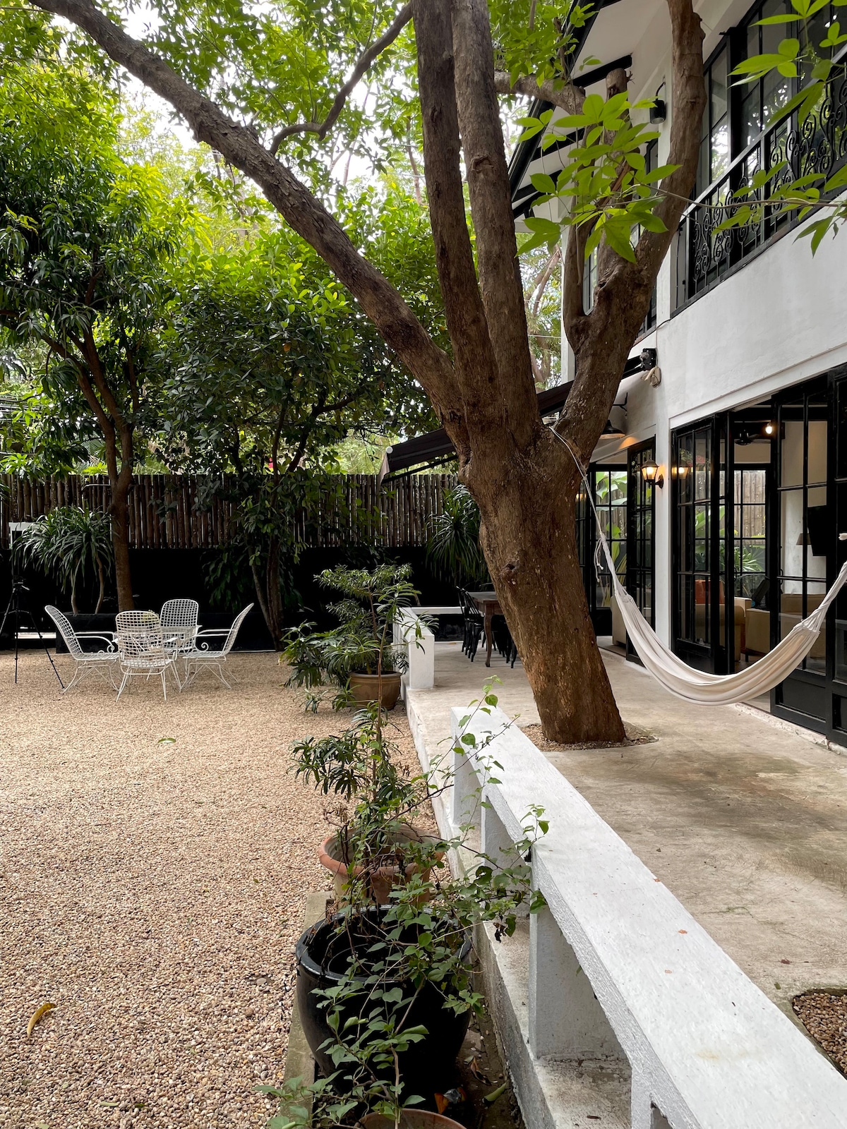 Casa Uno pool entrance with metal chairs